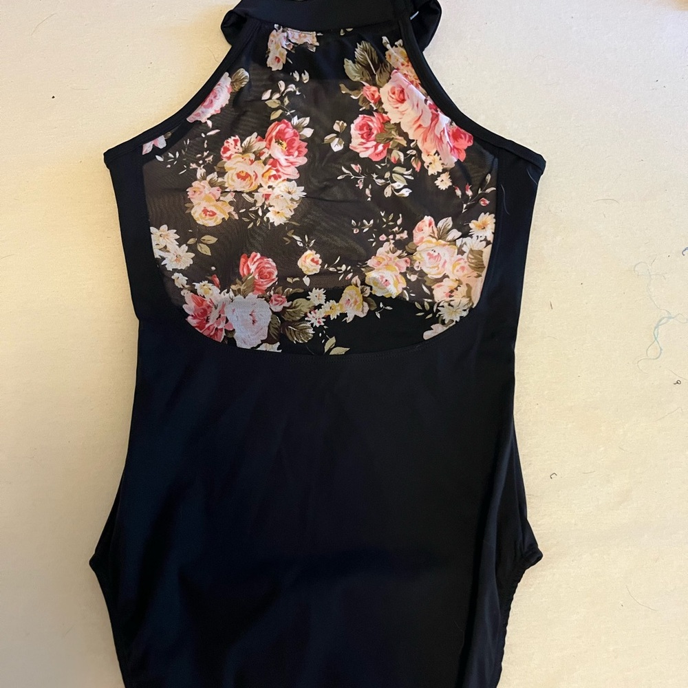 Beautiful sheer floral back leotard, snap collar and front lining. Never worn!